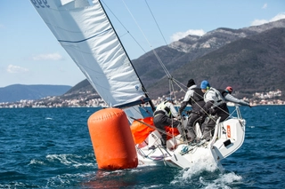 people on j70 boats sailing and competing